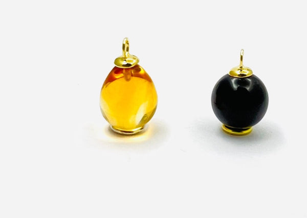 Wolter Anhänger CITRIN 18K Gold (links) & Wolter Anhänger ONYX 18K Gold (rechts)